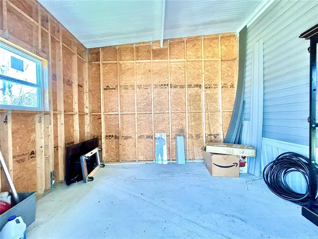 a view of a room with air conditioner and windows