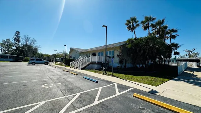 a view of a patio with a table and chairs