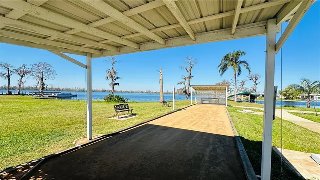 a view of a swimming pool with an outdoor seating