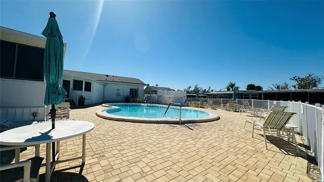 a view of a swimming pool with a chairs