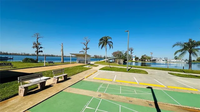 a view of a swimming pool with a lawn chairs