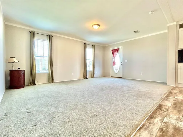 a view of an empty room with a window