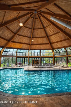 a view of a swimming pool with an outdoor seating
