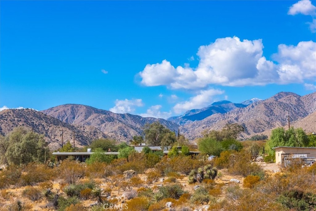 9457 Fobes Road Morongo Valley, CA 92256 - Photo 20 of 34 a view of a lake with a mountain in the background