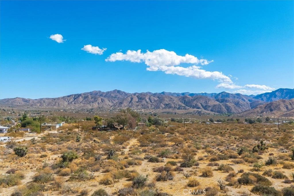 9457 Fobes Road Morongo Valley, CA 92256 - Photo 29 of 34 a view of a sky with mountains in the background