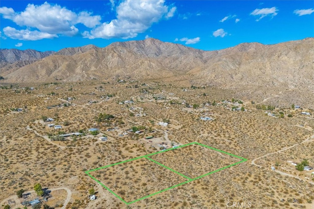 9457 Fobes Road Morongo Valley, CA 92256 - Photo 7 of 34 a view of a dry yard with wooden fence
