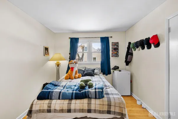 a bed room with furniture and a window