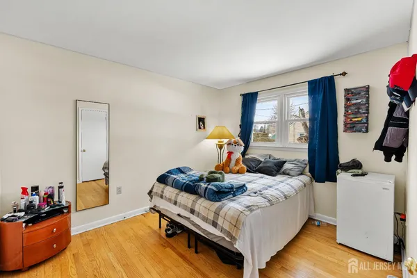 a bedroom with bed and a window