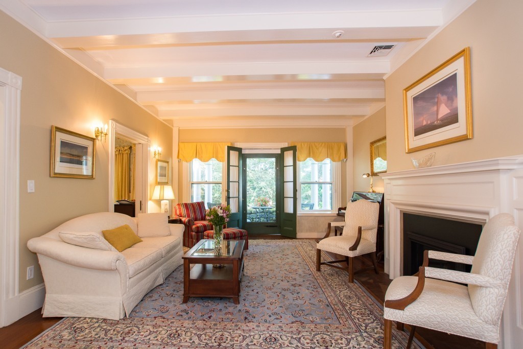 15 West Side Road Milton, MA 02186 - Photo 13 of 28 a living room with furniture and a fireplace