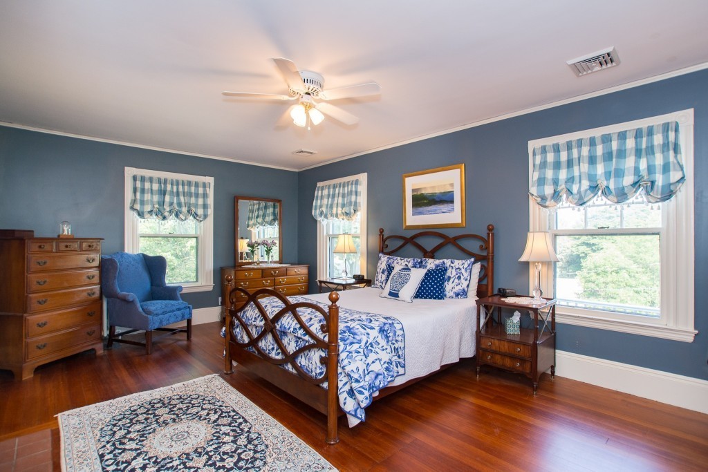 15 West Side Road Milton, MA 02186 - Photo 22 of 28 a bedroom with a bed a table and chair