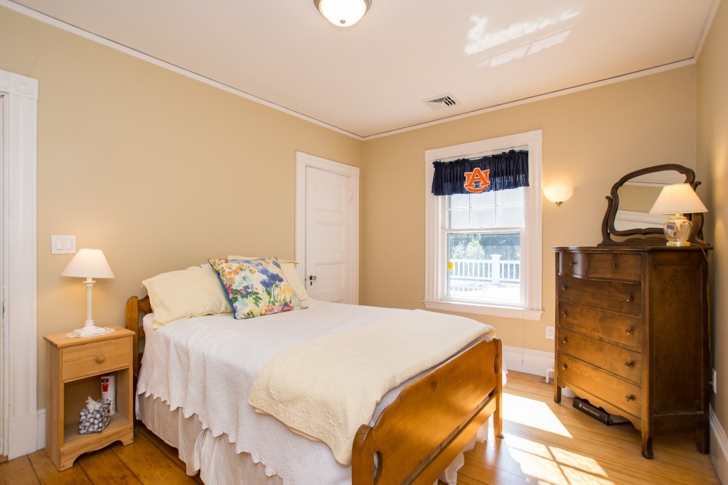 15 West Side Road Milton, MA 02186 - Photo 27 of 28 a bedroom with a bed and wooden floor