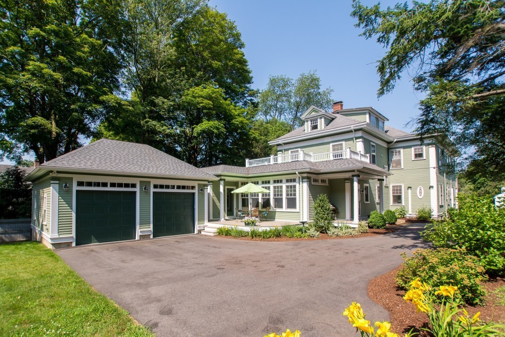 15 West Side Road Milton, MA 02186 - Photo 4 of 28 a front view of a house with garden and porch
