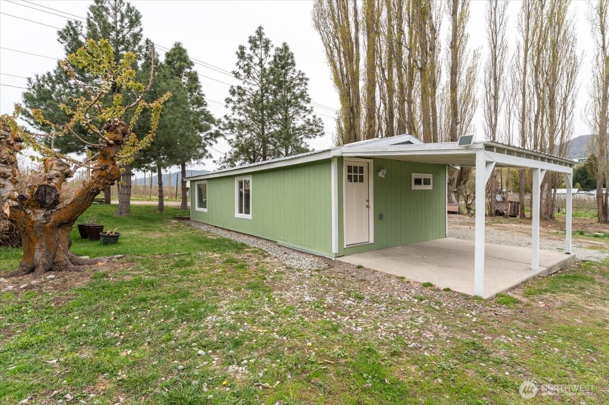 293 Barkley Road Manson, WA 98831 - Photo 27 of 40 a front view of a house with a garden