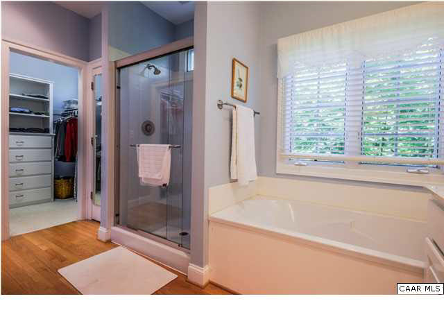 1549 Tavistock Place, Unit R 24 Keswick, VA 22947 - Photo 13 of 31 Awaken to serene wooded views from the expansive windows in the master suite. A charming window seat runs the length of the triple box bay window. With storage beneath, it's not just comfy & lovely, it's also practical.