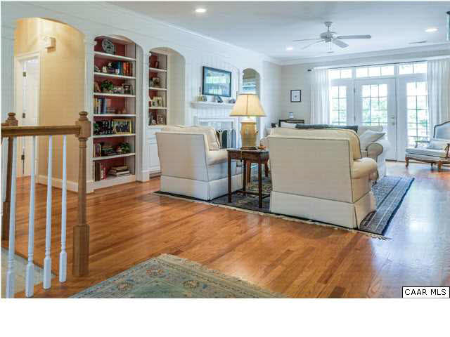 1549 Tavistock Place, Unit R 24 Keswick, VA 22947 - Photo 3 of 31 The casually elegant covered front porch, w/brick floor, arched openings, & trimmed columns, extends a gracious welcome. Relax in the cool shade of the lush landscaping that gracefully enfolds the front of the porch.