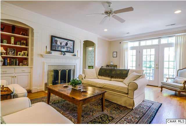 1549 Tavistock Place, Unit R 24 Keswick, VA 22947 - Photo 5 of 31 Step from the porch into an open entry area lit by the sidelights & transom surrounding the front door. A window over the open staircase provides additional light. Rich hardwood floors add a warm gleam to the space, shining in the light of recessed cans.
