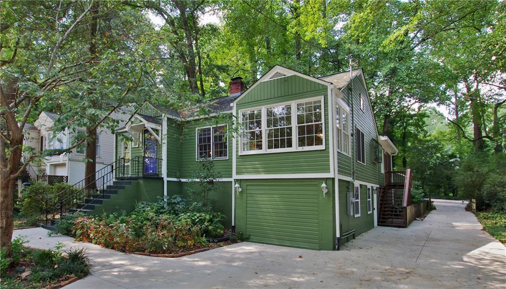 1177 Thomas Road Decatur, GA 30030 - Photo 1 of 1 a front view of a house with a garden