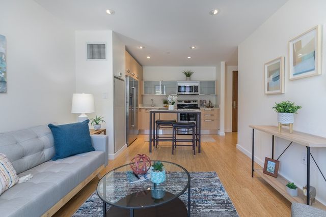 a living room with furniture and a table