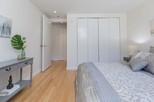 a bedroom with a bed and a hallway