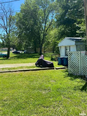 a backyard of a house with trampoline