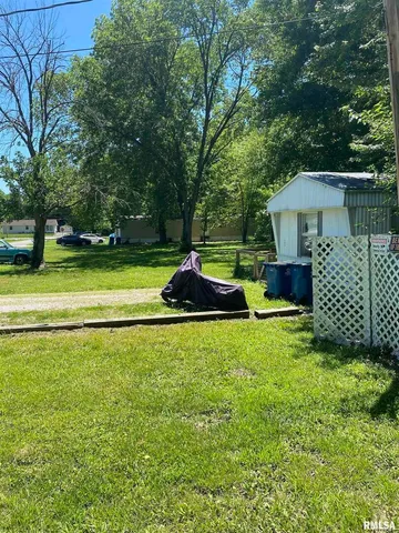 a backyard of a house with trampoline