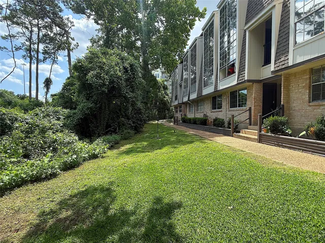 a view of a street with houses on both side