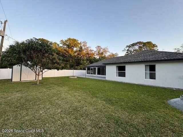 a backyard of a house with lots of green space