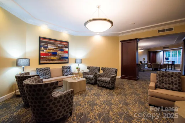 a room with lots of furniture and a chandelier