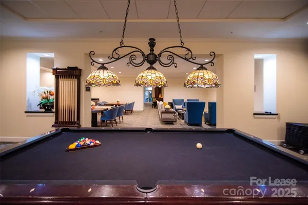 a large white kitchen with a large window