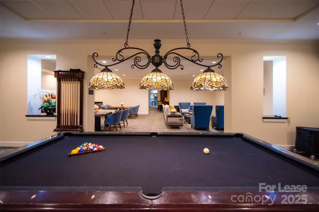 a large white kitchen with a large window