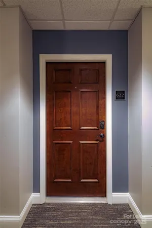 a kitchen that has a sink a stove and a refrigerator