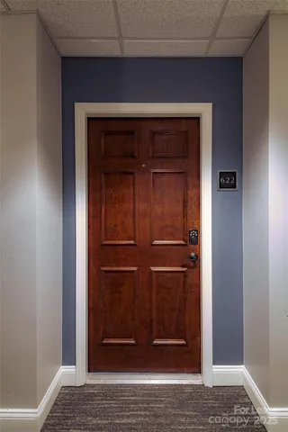 a kitchen that has a sink a stove and a refrigerator