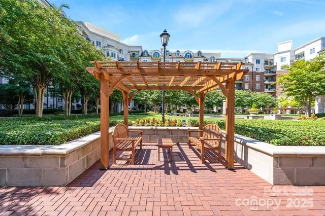a outdoor living space with furniture and a flat screen tv