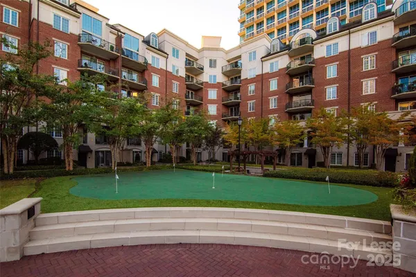 a view of a hallway with a large mirror