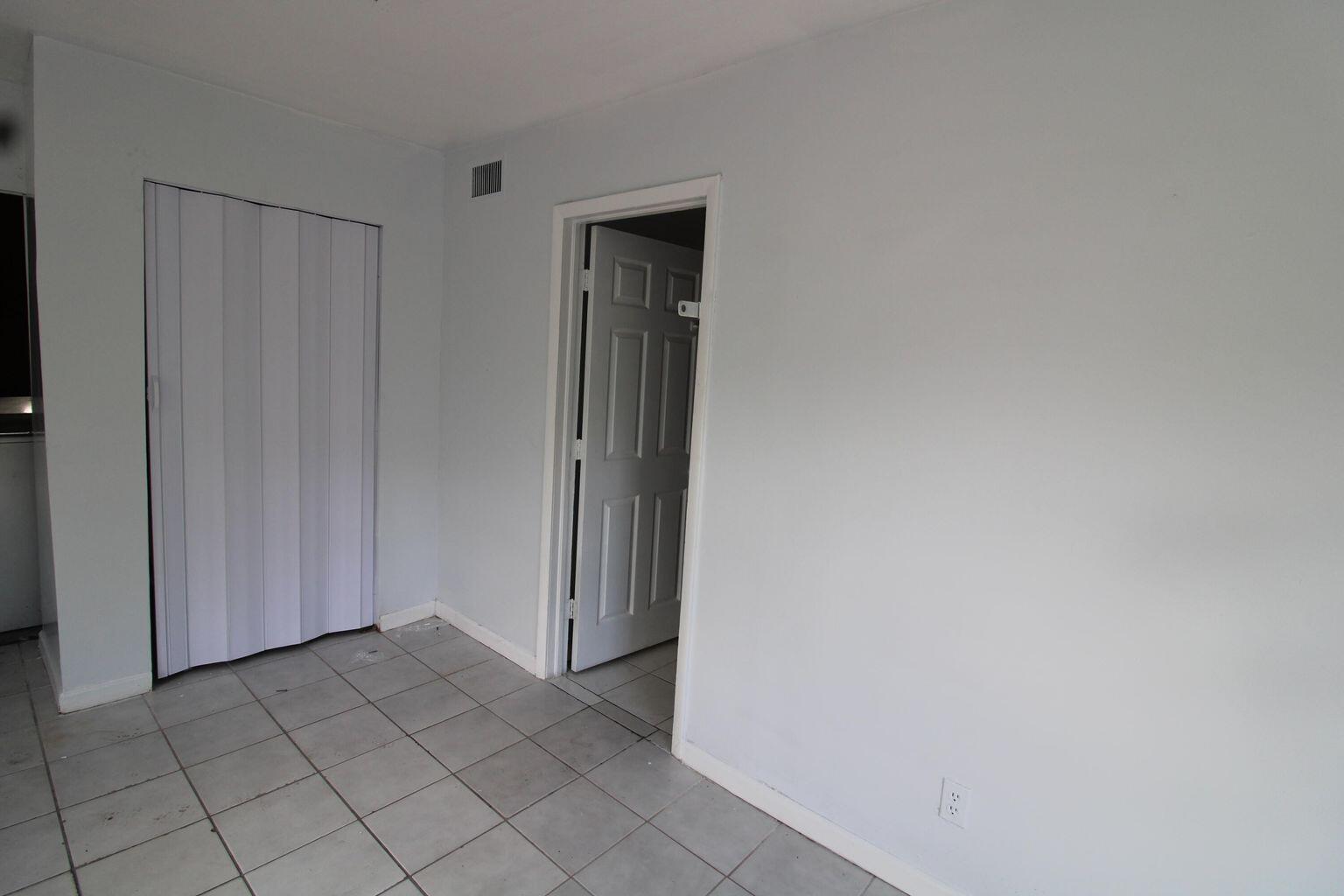 1645 West 31st Street Riviera Beach, FL 33404 - Photo 7 of 20 a view of a closet area with entryway