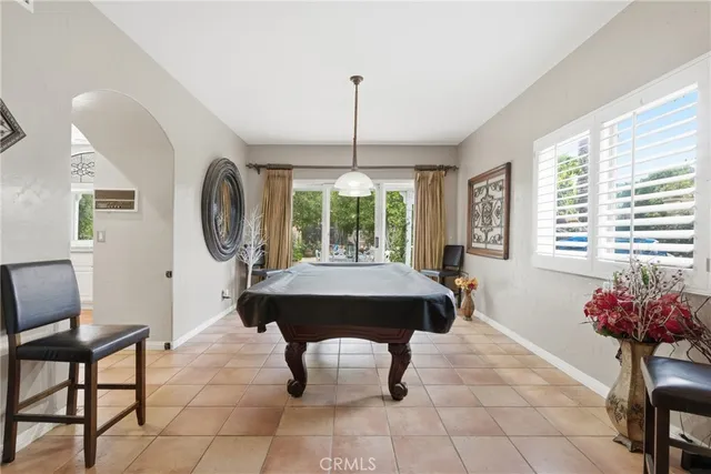 a large kitchen with a table and chairs