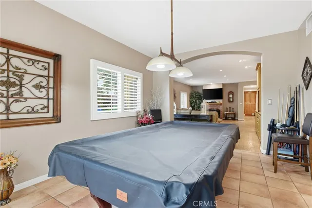 a view of an outdoor dining space with a table and chairs