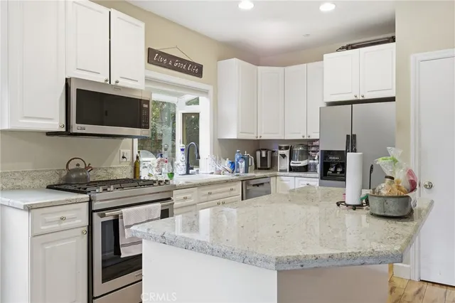 a bedroom with a bed and a table in it