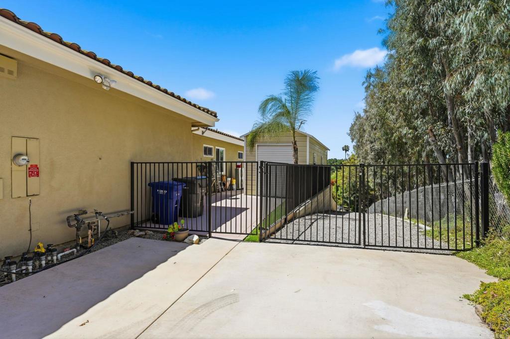 3835 Las Flores Drive Fallbrook, CA 92028 - Photo 55 of 73 a view of a house with a wooden fence