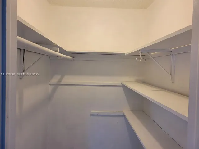 a view of an empty walk in closet