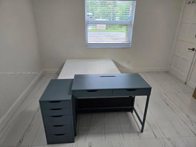 a room that has a table and a window