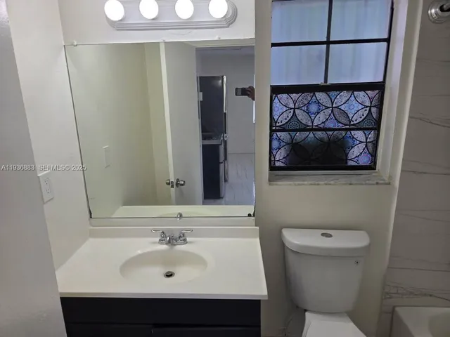 a bathroom with a sink and a toilet