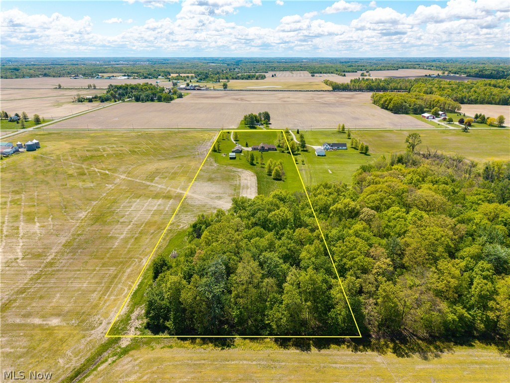 51488 Peck Wadsworth Road Wellington, OH 44090 - Photo 11 of 50 Expansive rural property featuring a substantial wooded area, open fields, and distant agricultural land