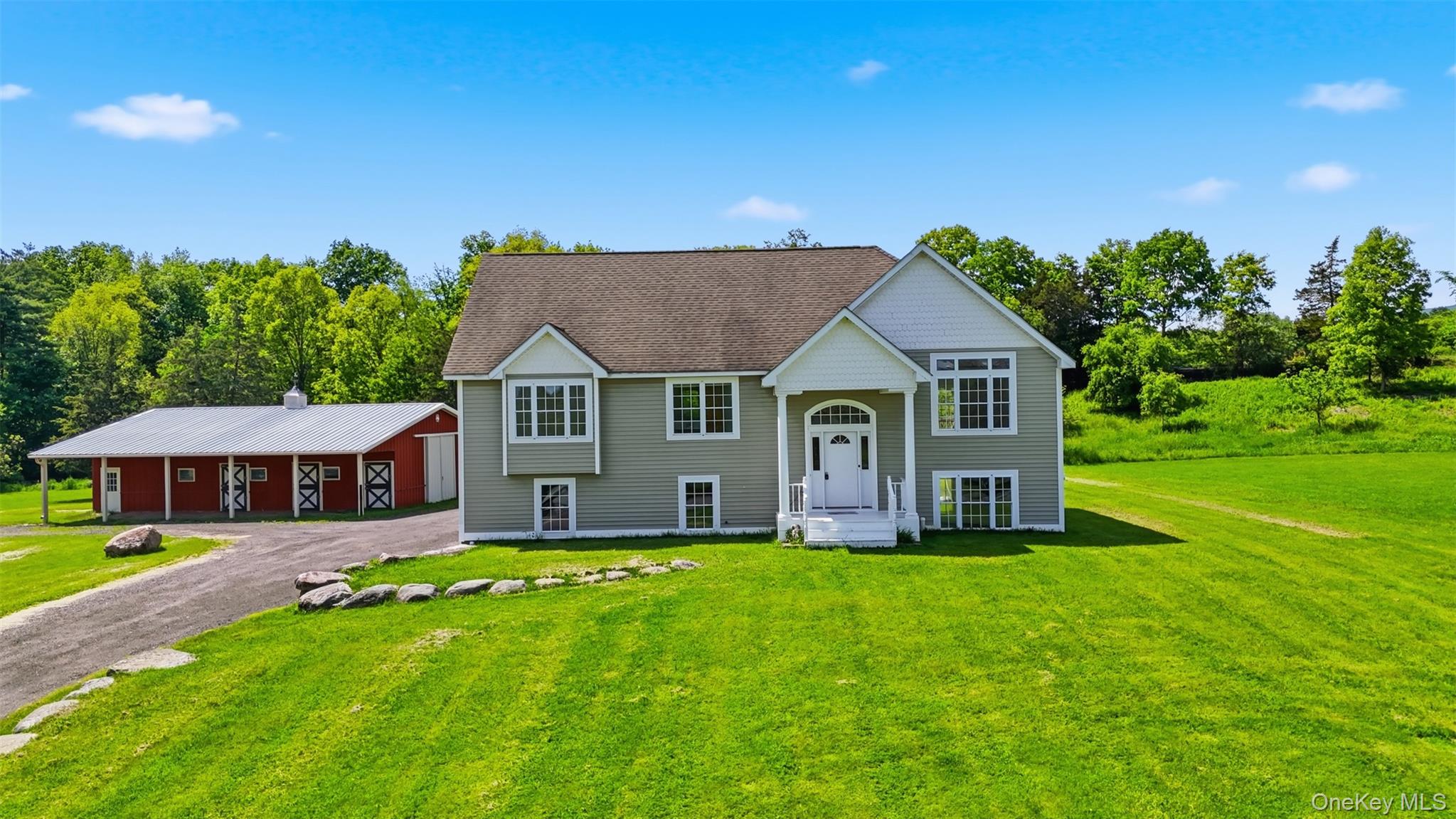 160 Pirog Road Pine Bush, NY 12566 - Photo 1 of 50 a front view of a house with a yard table and chairs