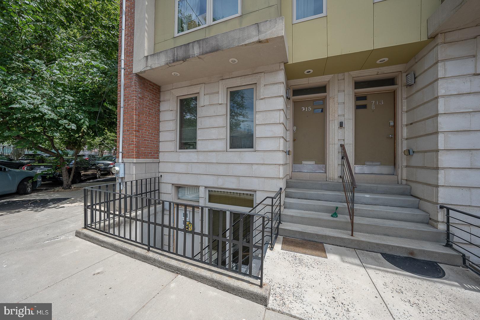 715 Shirley Street, Unit A Philadelphia, PA 19130 - Photo 1 of 24 a view of a house with a small yard and wooden floor and fence