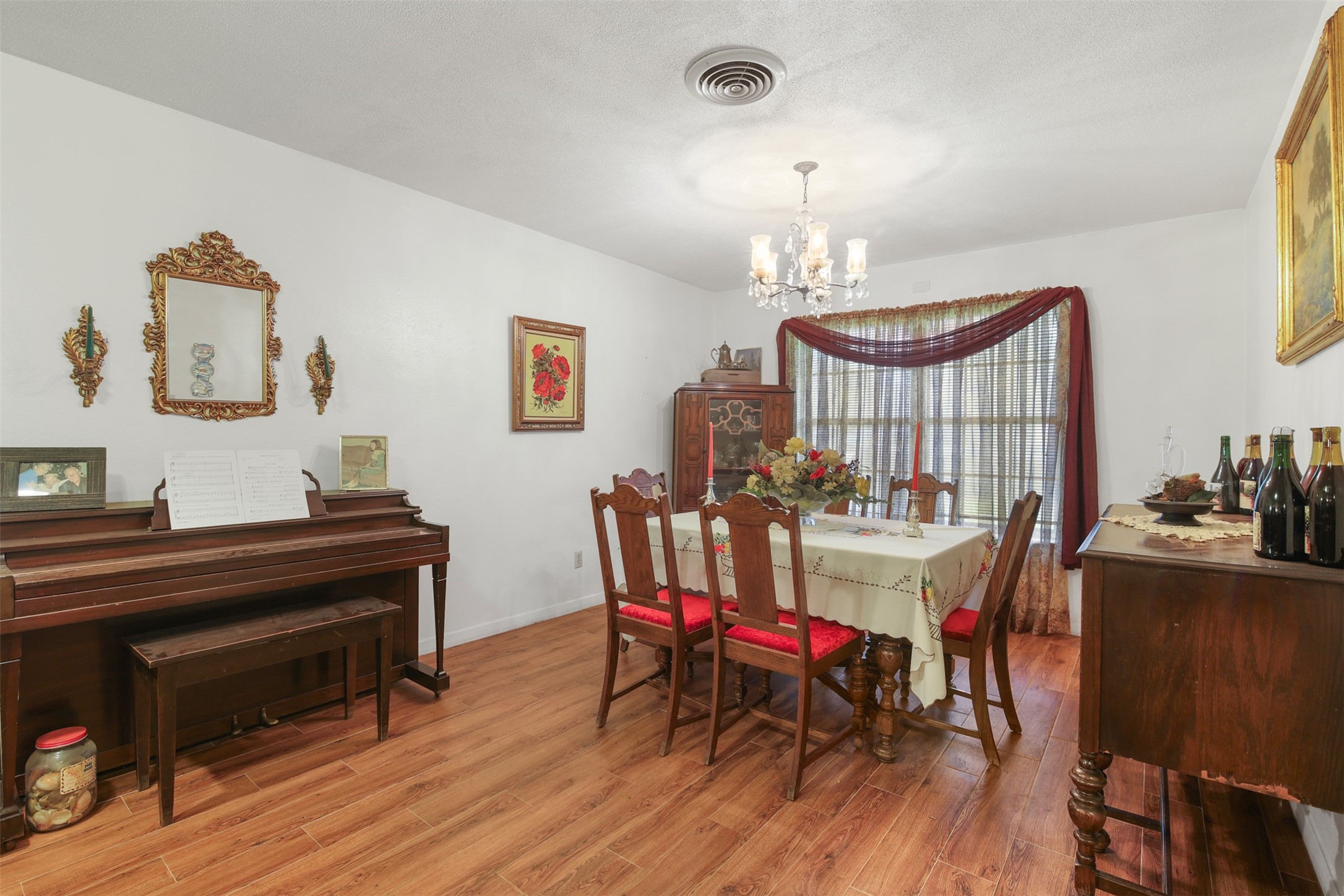 8406 East Mt Houston Road Houston, TX 77050 - Photo 3 of 30 a view of a dining room with furniture and wooden floor