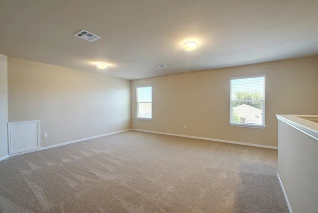 a view of a bathroom with a glass shower door