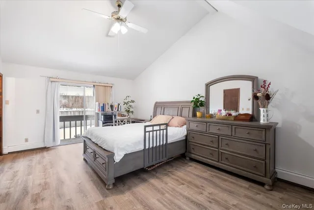 a living room with a bed furniture and a window