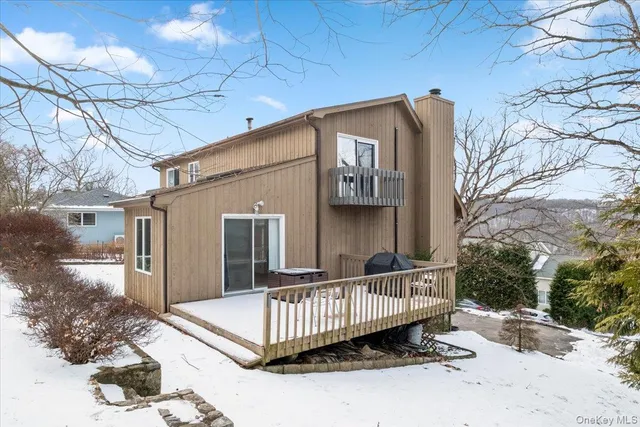 a view of a house with wooden fence