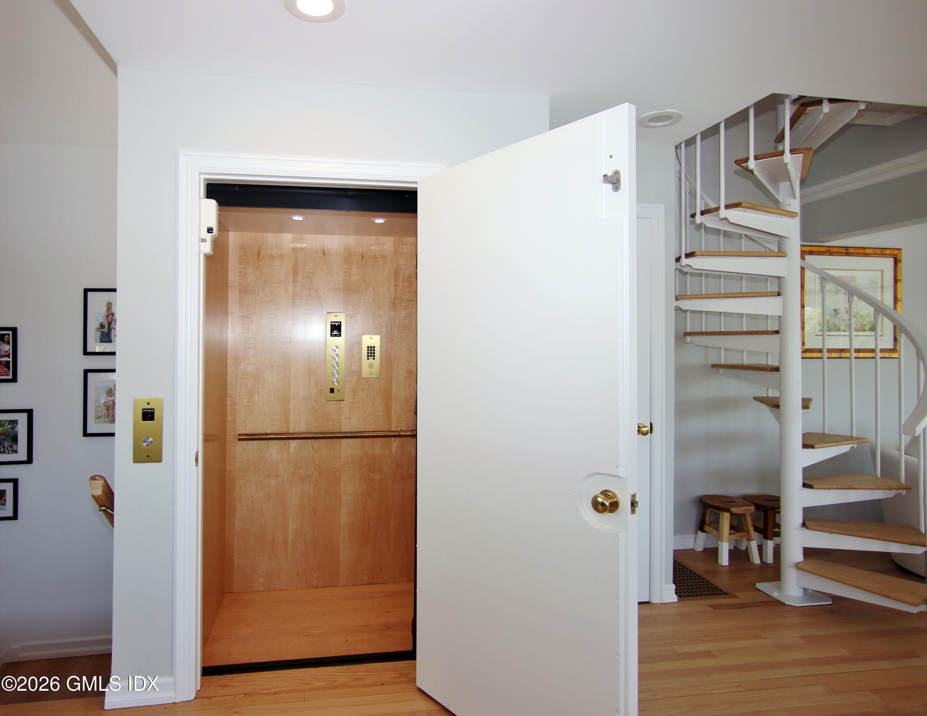 633 Steamboat Road, Unit 5 Greenwich, CT 06830 - Photo 16 of 29 a view of a hallway with closet and wooden floor